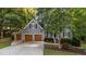 Beautiful two-story home featuring a three-car garage and a welcoming front porch at 905 Neuse Ridge Dr, Clayton, NC 27527