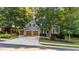 Charming two-story home features a well-manicured lawn, attached garage, and classic architectural details at 905 Neuse Ridge Dr, Clayton, NC 27527