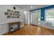 Welcoming foyer with hardwood floors, a console table, and a gallery wall showcasing personal photos at 905 Neuse Ridge Dr, Clayton, NC 27527