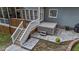 Backyard patio featuring a modern hot tub with surrounding hardscape and easy access via wooden steps at 905 Neuse Ridge Dr, Clayton, NC 27527