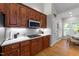 Kitchen features modern cabinets, white tile backsplash, stainless steel appliances and eat-in area at 905 Neuse Ridge Dr, Clayton, NC 27527