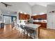 Open kitchen with white countertops, stainless steel appliances, and bar stool seating, perfect for entertaining at 905 Neuse Ridge Dr, Clayton, NC 27527