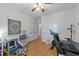 Spacious office area with a desk, exercise bike, whiteboard, and ample storage at 905 Neuse Ridge Dr, Clayton, NC 27527