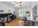 Bright office space with hardwood floors, multiple desks, and plenty of natural light at 905 Neuse Ridge Dr, Clayton, NC 27527