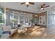 Inviting covered patio featuring outdoor seating, ceiling fans, and decorative string lights for relaxed entertaining at 905 Neuse Ridge Dr, Clayton, NC 27527