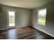 Bright dining room features hardwood floors and access to a patio through a glass door at 94 Starry Sky Dr, Benson, NC 27504
