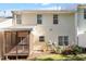 Backyard view featuring a screened-in porch and a mix of lawn space and planted garden area at 1 Edgebrook Cir, Durham, NC 27703