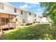 Expansive backyard showcasing a well-maintained lawn, screened porch, and a peaceful outdoor setting at 1 Edgebrook Cir, Durham, NC 27703