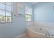 Bathroom features a bright window and soaking tub perfect for relaxation at 1 Edgebrook Cir, Durham, NC 27703