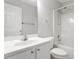 Bright bathroom featuring a white vanity, standard toilet, and shower with tub at 1 Edgebrook Cir, Durham, NC 27703