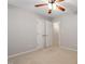 Bedroom boasts neutral walls, plush carpeting, and convenient double door access to storage at 1 Edgebrook Cir, Durham, NC 27703