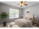 Bedroom with a plush bed, plenty of natural light, and neutral walls for a cozy feel at 1 Edgebrook Cir, Durham, NC 27703