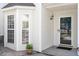 Well-lit front entrance with a glass-paneled door and adjacent bay window, enhancing curb appeal at 1 Edgebrook Cir, Durham, NC 27703