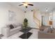 Inviting living room with modern decor, featuring a comfortable sofa, stylish coffee table, and a staircase at 1 Edgebrook Cir, Durham, NC 27703