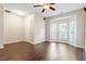 Living room featuring bay window, ceiling fan, and wood laminate flooring at 1 Edgebrook Cir, Durham, NC 27703