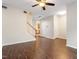 View of the spacious living room featuring wood laminate flooring and staircase at 1 Edgebrook Cir, Durham, NC 27703