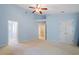 Spacious main bedroom featuring high ceilings, neutral walls, plush carpet, and ensuite access at 1 Edgebrook Cir, Durham, NC 27703
