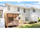 Exterior view of a home with a screened porch, landscaping, and neutral siding at 1 Edgebrook Cir, Durham, NC 27703