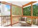 Comfortable screened-in porch with outdoor seating, perfect for relaxation and enjoying the outdoors at 1 Edgebrook Cir, Durham, NC 27703