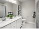Modern bathroom featuring a double vanity, light gray walls, and tiled floors at 1012 Country Pasture Cv, Wendell, NC 27591