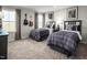 Shared bedroom with two beds, guitar decor, and bright windows allowing natural light at 1012 Country Pasture Cv, Wendell, NC 27591