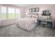 Cozy bedroom with pink walls, a desk, and large window providing plenty of natural light at 1012 Country Pasture Cv, Wendell, NC 27591