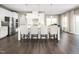 A spacious kitchen with white cabinets, a large island, stainless steel appliances and dark wood floors at 1012 Country Pasture Cv, Wendell, NC 27591