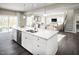 Open concept kitchen with a marble island, a stainless steel dishwasher and a view into the living room at 1012 Country Pasture Cv, Wendell, NC 27591