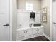 Well-organized mudroom with storage bench, hooks, and charming decor for added functionality and appeal at 1012 Country Pasture Cv, Wendell, NC 27591