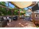 Inviting backyard with a sunshade, seating, grill, and well-maintained wooden deck perfect for outdoor gatherings at 1028 Bellenden Dr, Durham, NC 27713