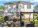 Well-maintained backyard featuring a multi-level deck, grill area, and shade structures for outdoor enjoyment at 1028 Bellenden Dr, Durham, NC 27713