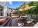 Large backyard featuring a wooden deck, sunshade, and a grassy area for recreational activities at 1028 Bellenden Dr, Durham, NC 27713