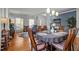 Open-concept dining room with wood floors, natural light, and stylish furnishings at 1028 Bellenden Dr, Durham, NC 27713