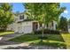 Beautiful two-story home with a two-car garage, front porch, and a lush green lawn at 1028 Bellenden Dr, Durham, NC 27713