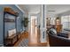 Inviting hallway with hardwood floors, decorative accents, and seamless flow to other living spaces at 1028 Bellenden Dr, Durham, NC 27713
