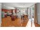Eat-in kitchen with stainless appliances, granite countertops, and hardwood floors, perfect for Gathering meals at 1028 Bellenden Dr, Durham, NC 27713