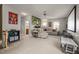 Spacious living room with comfortable seating, a large wall mural, and a view into an adjacent space at 1028 Bellenden Dr, Durham, NC 27713
