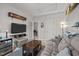 Cozy living room with comfortable couch, dark wood coffee table, television and peek into adjacent space at 1028 Bellenden Dr, Durham, NC 27713
