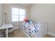 Bedroom with desk, natural light, and neutral decor at 10529 Sablewood Dr # 116, Raleigh, NC 27617
