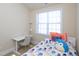 Bedroom with desk, natural light, and neutral decor at 10529 Sablewood Dr # 116, Raleigh, NC 27617
