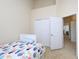 Bedroom featuring closet space, door, and neutral decor at 10529 Sablewood Dr # 116, Raleigh, NC 27617
