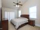 Spacious bedroom featuring a ceiling fan, dual windows, and neutral-colored walls at 10529 Sablewood Dr # 116, Raleigh, NC 27617