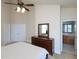 Bedroom view showcasing a closet and a dresser with a mirror at 10529 Sablewood Dr # 116, Raleigh, NC 27617