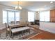 Inviting dining room features a beautiful rug, a bay window, and lots of natural light at 10529 Sablewood Dr # 116, Raleigh, NC 27617