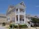 Well-maintained home with a double balcony, manicured bushes, and a convenient attached garage at 10529 Sablewood Dr # 116, Raleigh, NC 27617