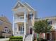 Beautiful home featuring a spacious double balcony, light exterior, and landscaped front yard at 10529 Sablewood Dr # 116, Raleigh, NC 27617