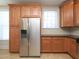 Spacious kitchen features stainless steel appliances, plenty of wood cabinetry, and lots of storage at 10529 Sablewood Dr # 116, Raleigh, NC 27617