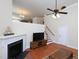 Bright living room with a fireplace, hardwood floors, and an open staircase, perfect for modern living at 10529 Sablewood Dr # 116, Raleigh, NC 27617