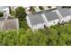 Aerial view of the home, lawn, and surrounding homes and neighborhood streets at 107 Caraleigh Ct, Morrisville, NC 27560