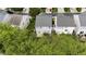Aerial view of backyard, trees, neighborhood streets, and neighboring homes at 107 Caraleigh Ct, Morrisville, NC 27560